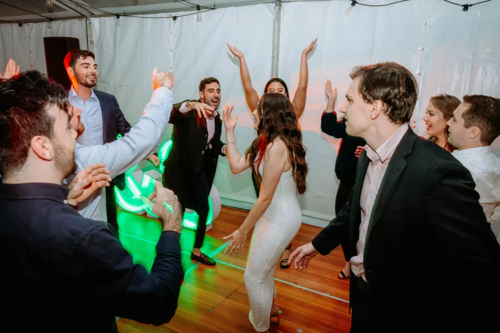 Couple Celebrating Their Engagement Surrounded by Loved Ones