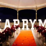 Nighttime illuminated MARRY ME setup