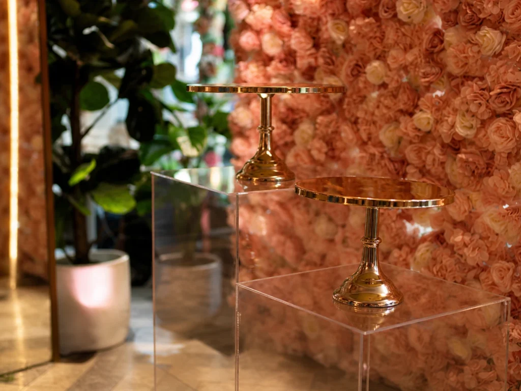 Floral wall backdrop with gold stand