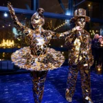 Gold mirror suit performers posing at an evening event