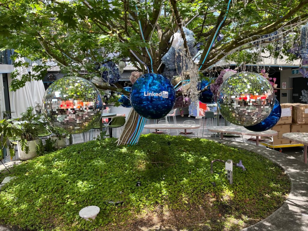 Hanging blue sphere decorations in trees