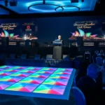 Colorful illuminated square tile LED dance floor setup indoors