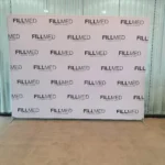 Grid step and repeat media wall printed with repeated logos