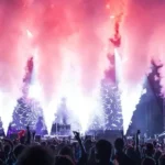 Bright fiery flame effects firing upward on concert stage