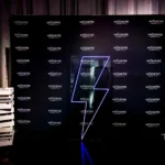 Branded media wall with illuminated logo