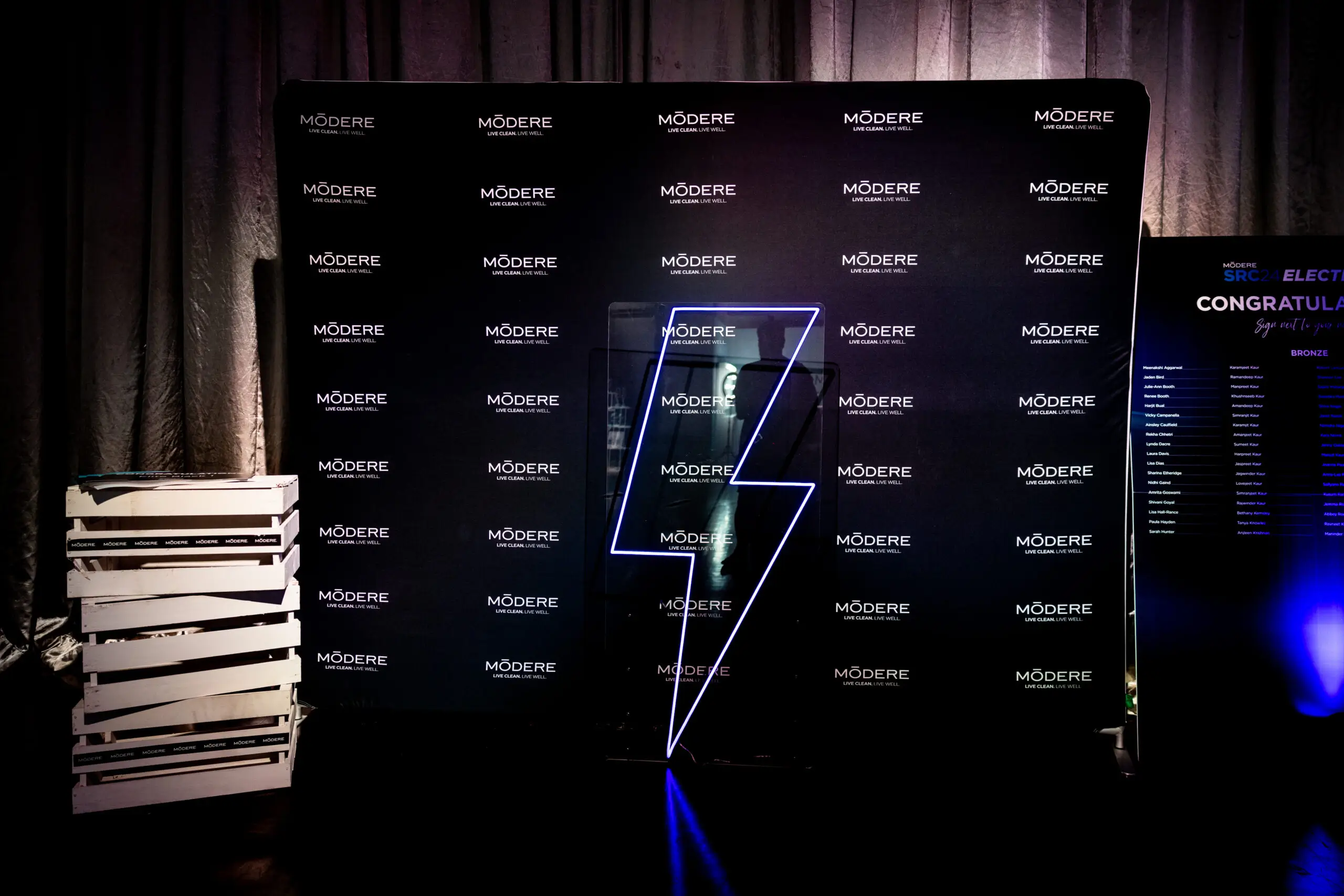 Branded media wall with illuminated logo