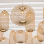 Close-up of glowing woven bamboo pendant light fixtures