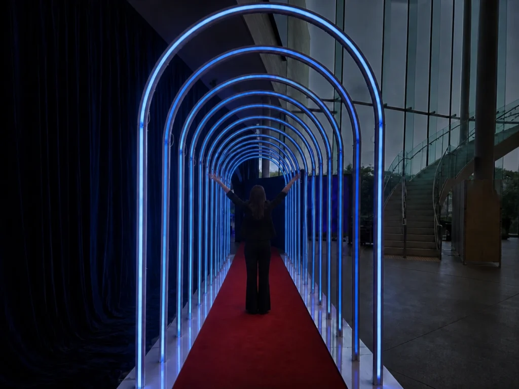 Blue illuminated archway entrance tunnel