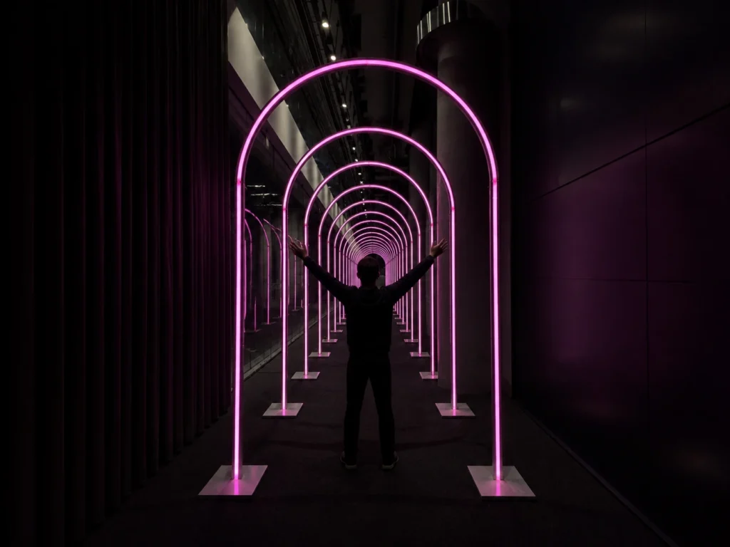 Pink illuminated arch tunnel experience