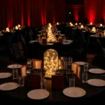 Illuminated glass bell jar cloche centerpiece display on event table