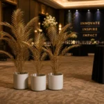 Tropical palm display with event branding