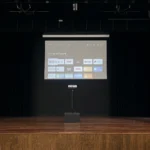 Ultra short throw projector displaying screen on stage setup