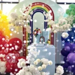 Colorful rainbow backdrop with balloon arches
