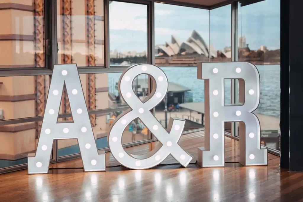 White light-up initials with ampersand for wedding decor