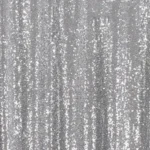Close-up texture view of sparkling silver sequin backdrop panel.