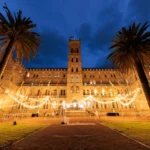 Illuminated heritage courtyard building illuminated for an evening event reception