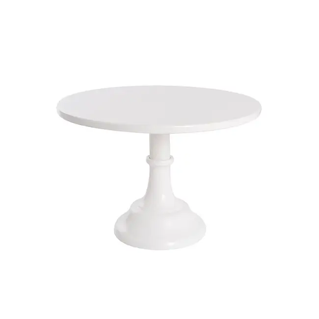 White pedestal cake stand against a plain white background