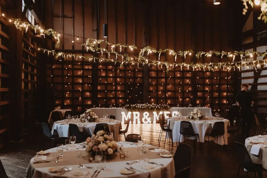 Hanging vine lighting installation for weddings