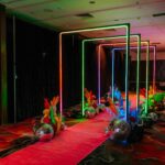Colorful rectangular LED archways forming light tunnel pathway