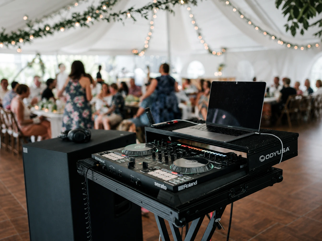 Professional DJ sound system setup inside a wedding reception venue.