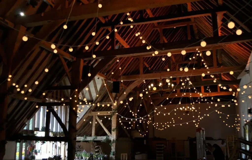 Festoon lighting across event venue ceiling